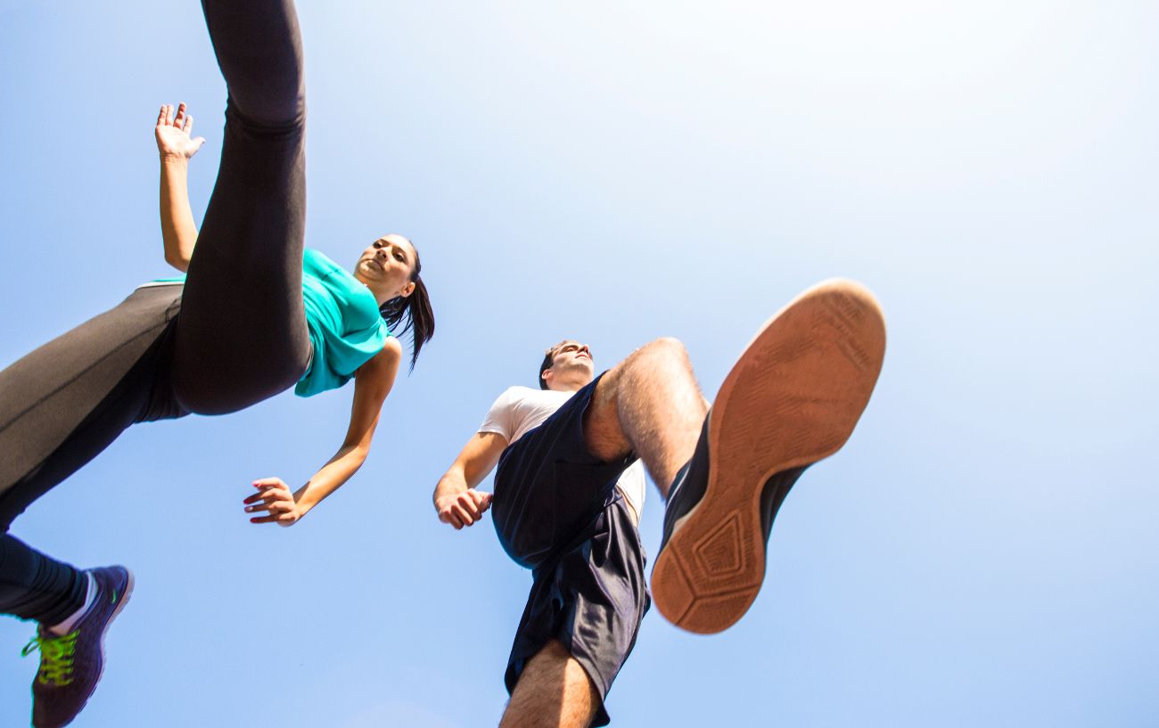 a man and woman jumping in the air