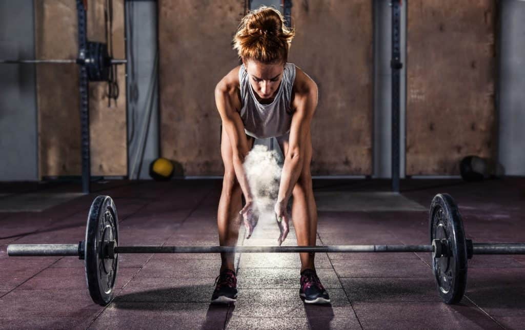 a lady preparing to lift a dumbbell