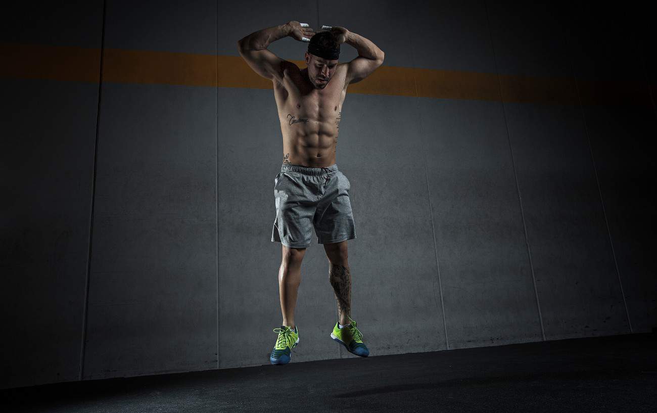 A man doing a burpee.