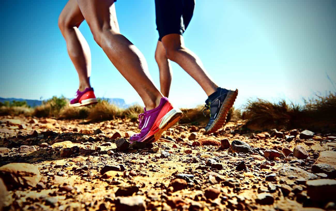 Two people running after leg day.