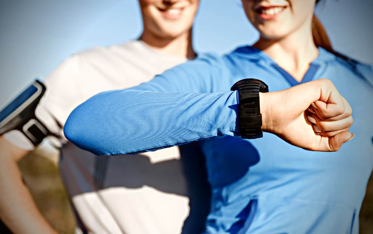 Cardiac Drift: What It Is And How It Affects Your Training 6 Two people looking at a watch.