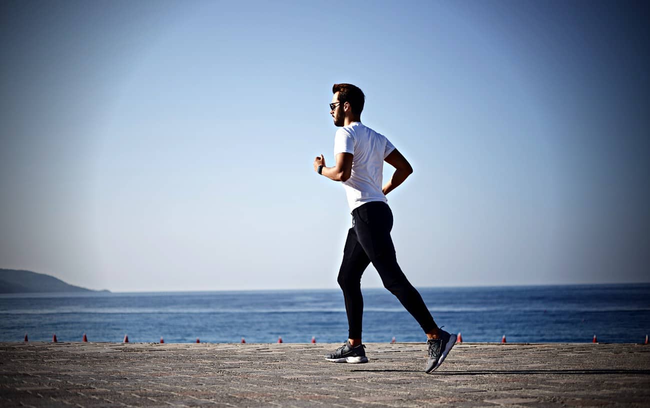 A person running on the beach.