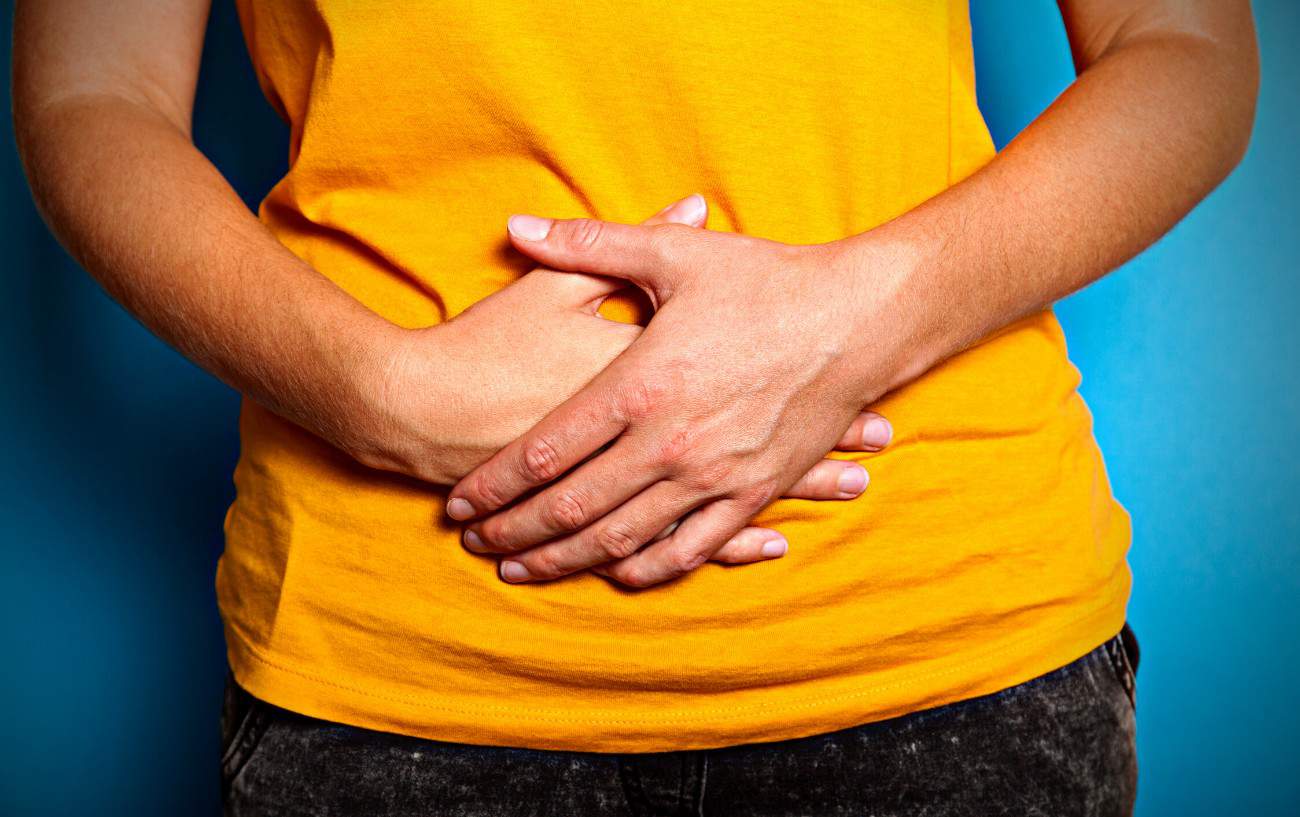 A person holding their stomach.