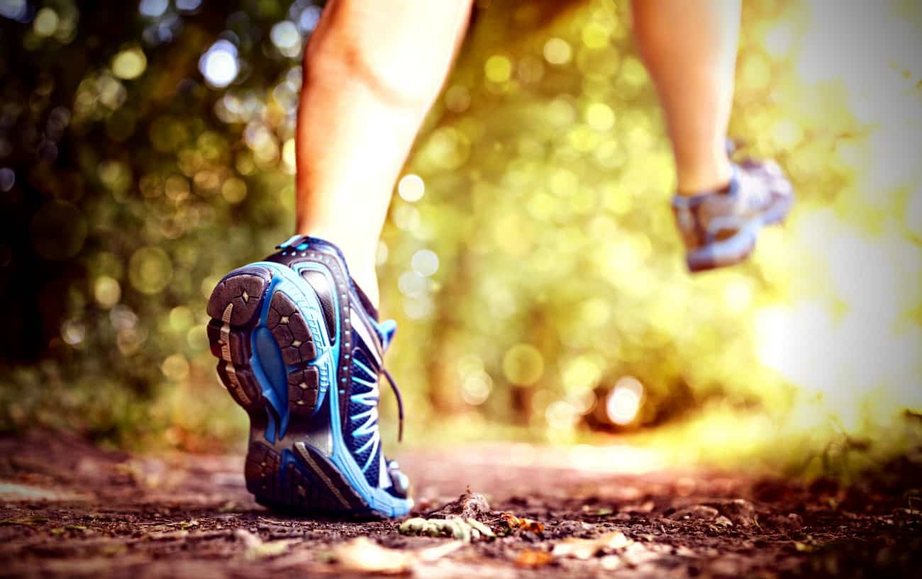 A close-up of a person's feet trail running.