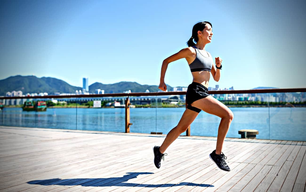 A person running along the water.