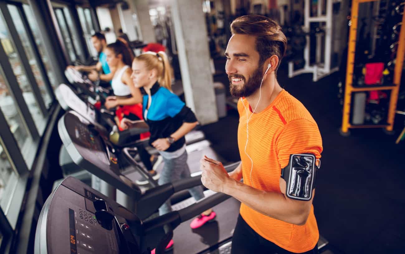 People on treadmills at the gym.