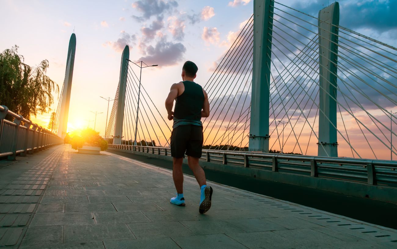 A person running over a bridge.