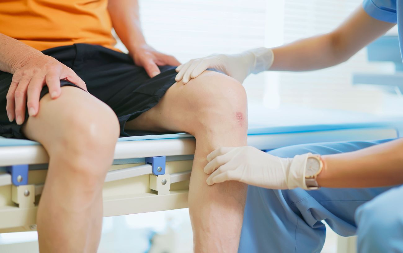 A doctor assisting a patient.