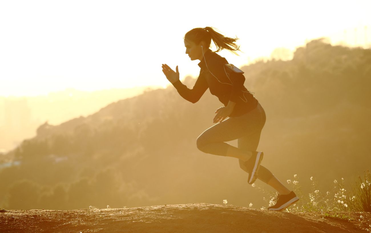 Someone running a hill sprint.