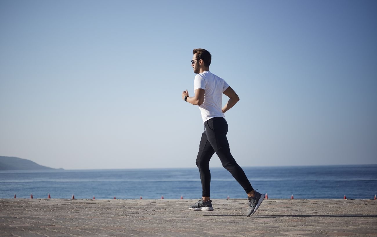 A person running on the beach.