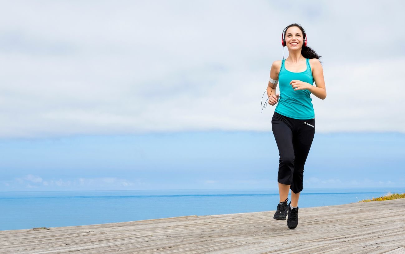 A person running on the beach.