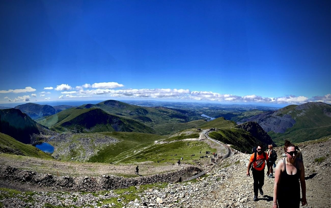 People walking on a rocky trail.