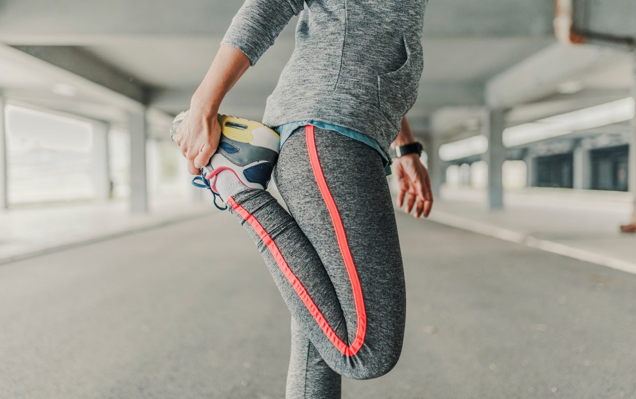 Woman doing a quad stretch