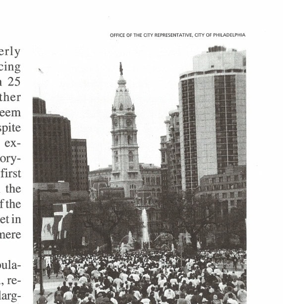 Philadelphia Marathon runners with City Hall in the background.