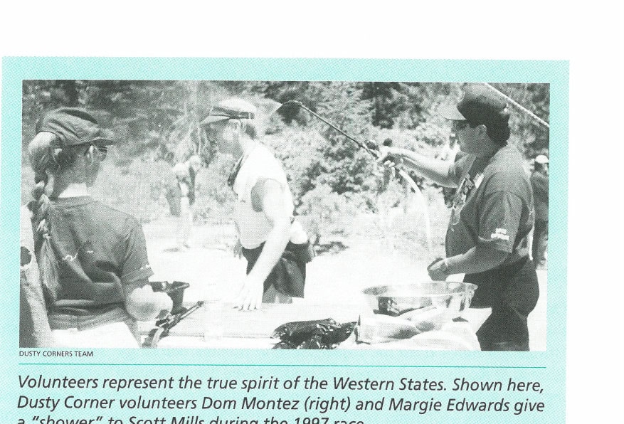 The History of Western States 45 Volunteers represent the true spirit of the Western States. Shown here, Dusty Corner volunteers Dom Montez (right) and Margie Edwards give a "shower" to Scott Mills during the 1997 race.