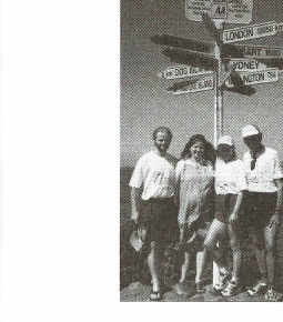 Marathon & Beyond — January/February 2001 Table of Contents 1 Millennium 2000KM — runners at a road sign post in New Zealand