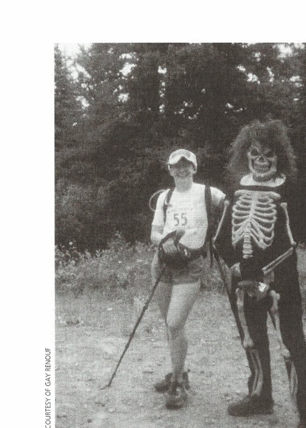 Gay posing with one of the many volunteers dressed up in death themes.