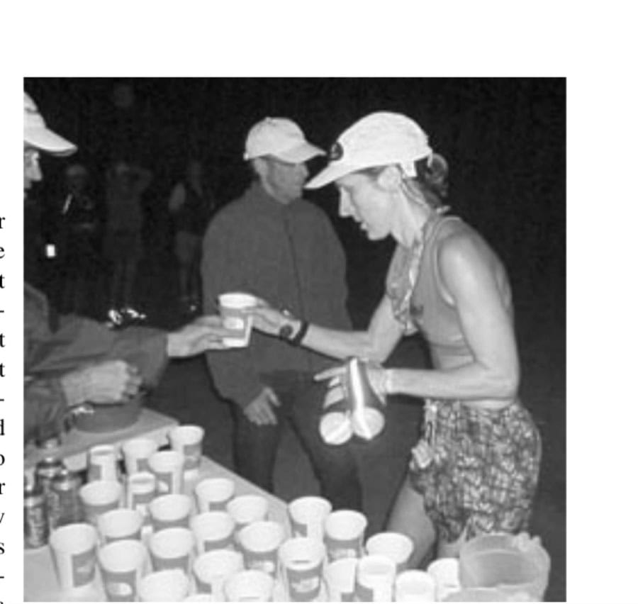 A Marathoner’s Next 13 Janice Anderson at an aid station during the Western States 100.
