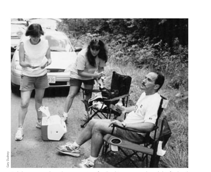 Robert contemplates the next section of trail as his crew sorts through his food and equipment.