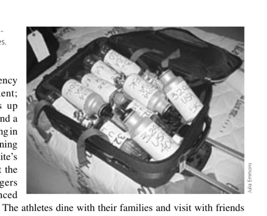 They Practice On Mountains 18 Suitcase with the athletes' personal aid bottles. (Deena's are the black-capped ones.)