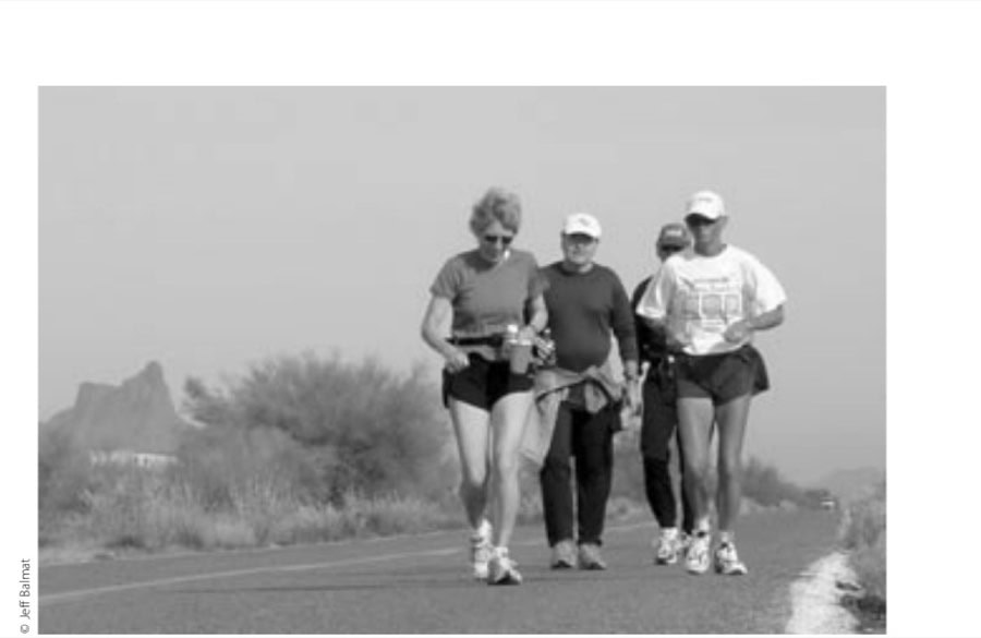 Melinda Bodell (front left) and friends converse with and around Reed (white shirt).