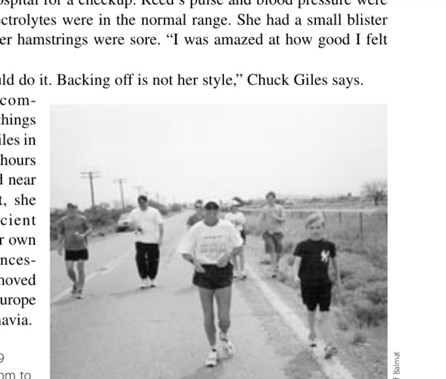Reed's son Jackson, 9 (right), accompanies mom to the finish line.