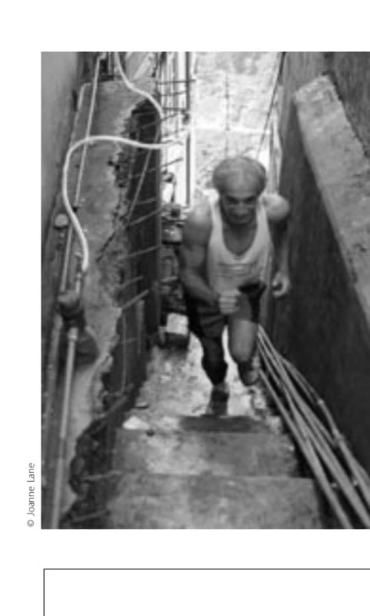 Peter Lane running through the bazaar in Mussoorie up a narrow flight of stairs.