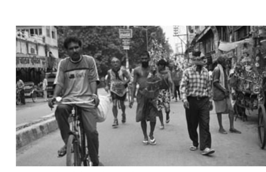 Peter runs through the Haridwar crowds.