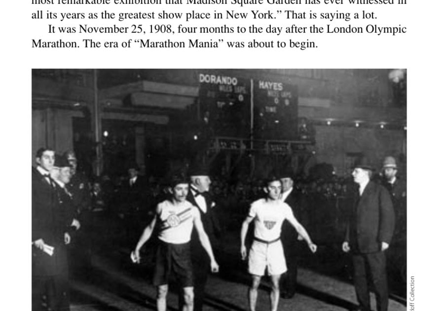 Two small, determined and very fit men: Pietri (left) and Hayes on the line at Madison Square Garden, November 25, 1908. Behind them the indicator board rises through the tobacco smoke, ready to show their "miles" and "laps."
