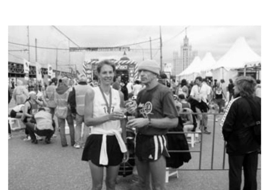 From Moldova And Moscow With Love 14 The author and Coach Anatolie celebrating her Boston-qualifying time, with sweet tea and salty bread, after the Moscow Peace Marathon.