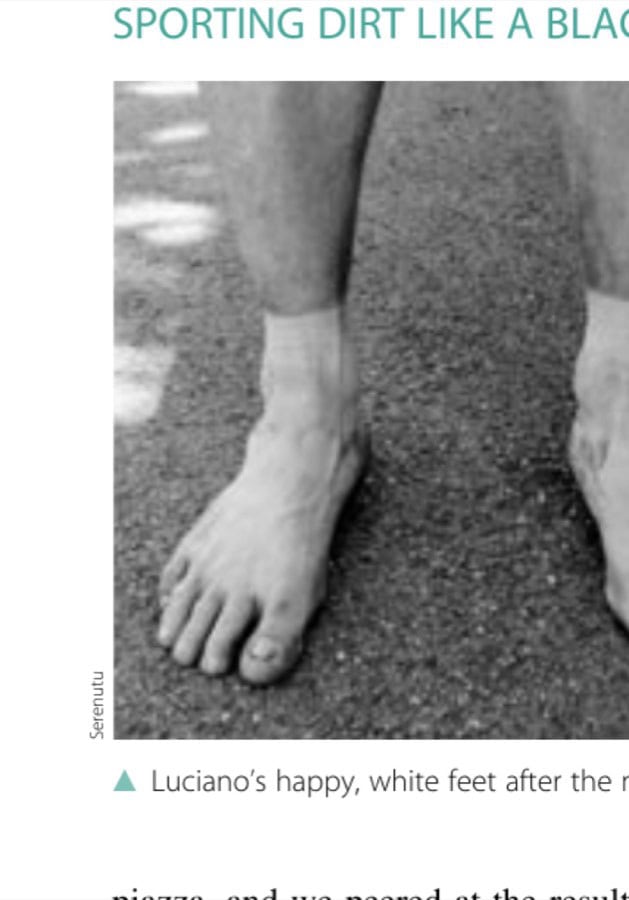 Luciano's happy, white feet after the marathon.