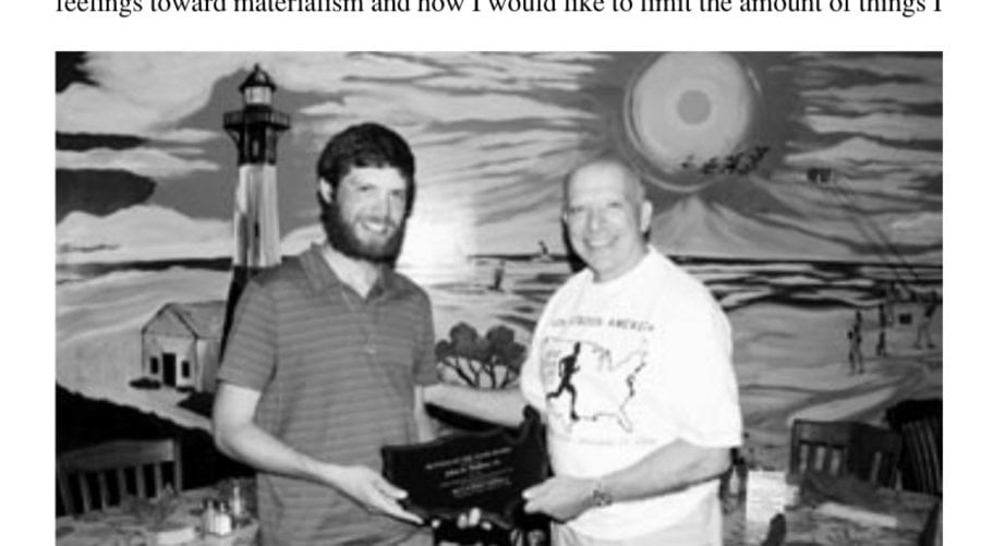 Tybee Island, Georgia: John Strumsky, president of the United States Running Streak Association, presents John with the Runner of the Year Award for his run across America.