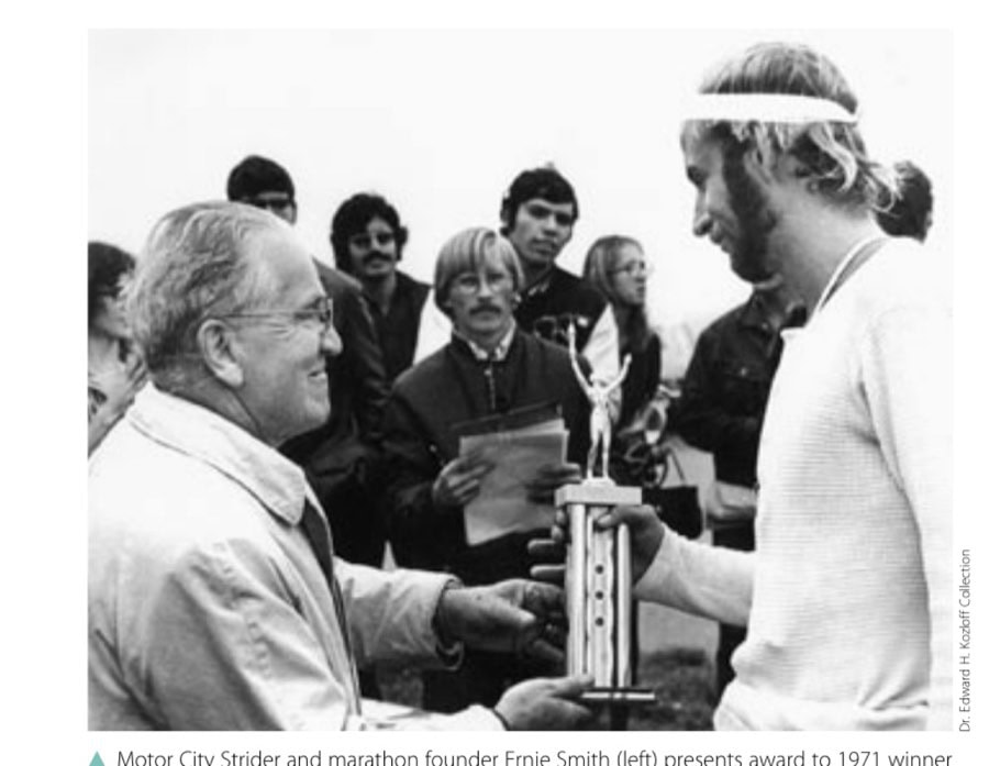 Motor City Strider and marathon founder Ernie Smith (left) presents award to 1971 winner Mike Hazilla (2:16:20), who also won the race in 1966.