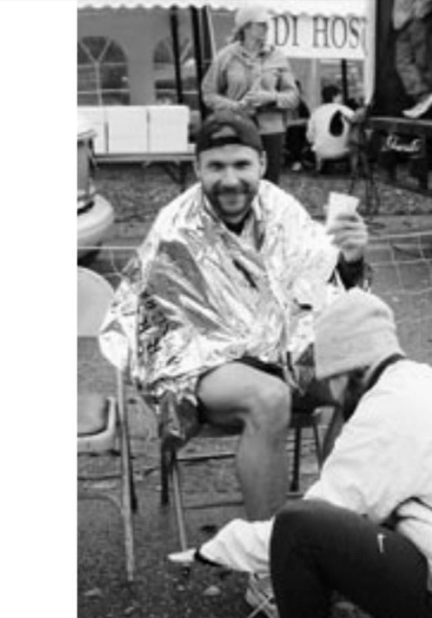 A friendly volunteer removes the author's timing chip.