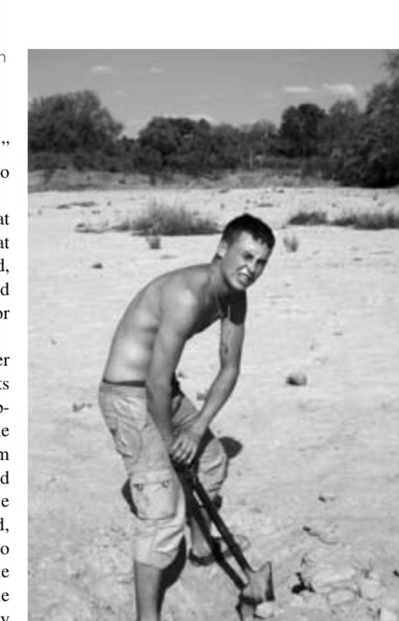 Shayne digging for water in the Busi Riverbed.