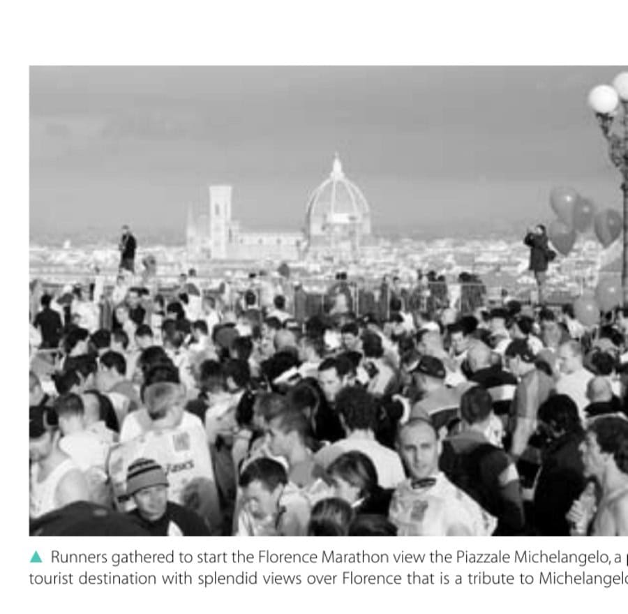 Runners gathered to start the Florence Marathon view the Piazzale Michelangelo, a popular tourist destination with splendid views over Florence that is a tribute to Michelangelo.