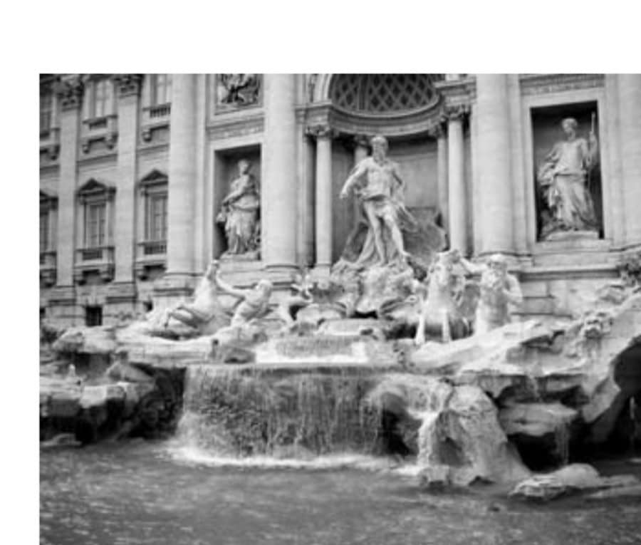 The marathon course goes by the Trevi Fountain. What you don't see as the author runs by is all the tourists laughing and saying, "Come on in; the water is fine."