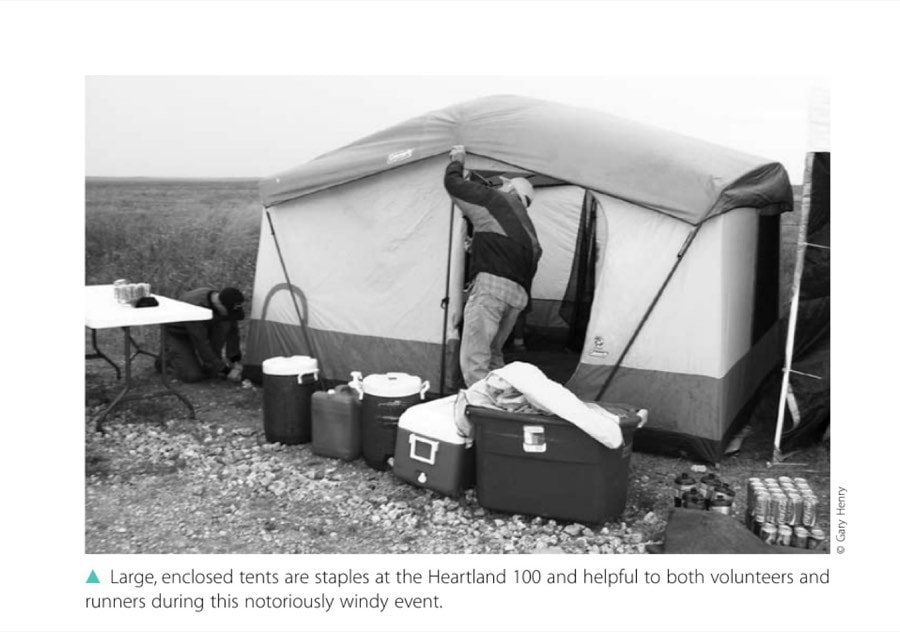 Large, enclosed tents are staples at the Heartland 100 and helpful to both volunteers and runners during this notoriously windy event.