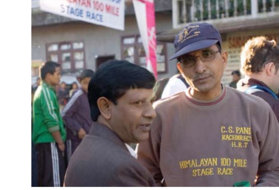 C.S. Pandey confers with a local official at the race's start line.