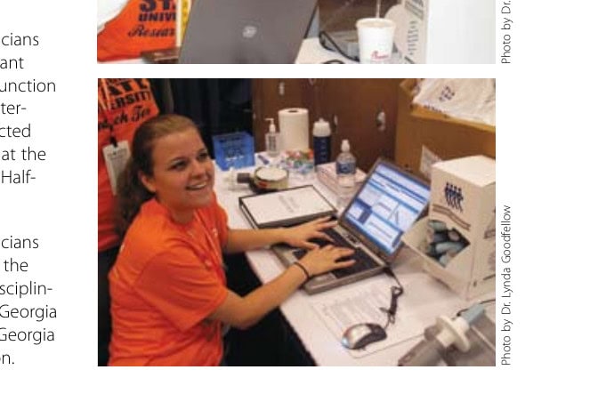 FIGURE 2: Student technicians enter measurement data at the prerace expo for the interdisciplinary research conducted by Georgia State University at the ING Georgia Marathon and Half-Marathon.