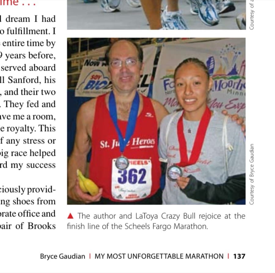 My Most Unforgettable Marathon (Vol. 13, No. 4) 27 The author and LaToya Crazy Bull rejoice at the finish line of the Scheels Fargo Marathon.