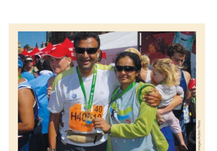 The author is welcomed at the finish line by his wife, Neepa, who earlier in the day had finished a 21K run.