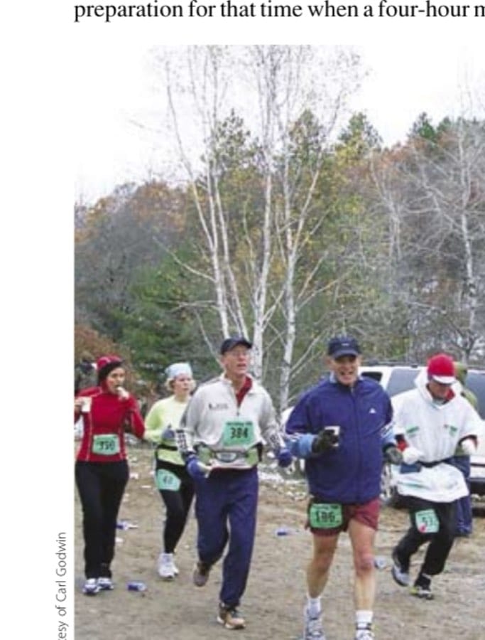 The author (in shorts) and his pacer, brother-in-law John (384), as they make their way through an aid station early in the race.