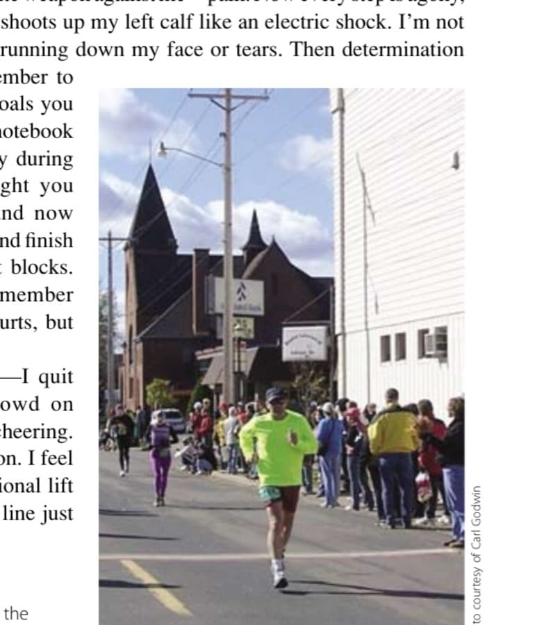 The author pushing through the pain—only a block from the finish.