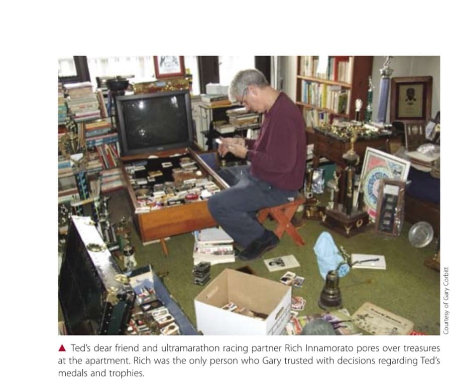 Ted's dear friend and ultramarathon racing partner Rich Innamorato pores over treasures at the apartment. Rich was the only person who Gary trusted with decisions regarding Ted's medals and trophies.