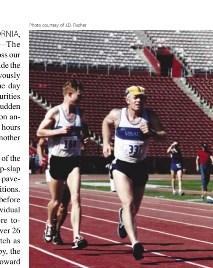 My Most Unforgettable Marathon (Vol. 14, No. 4) 11 The author (#337) charges down the final stretch to complete his own Olympic Marathon race while Craig Newport gives him encouragement.