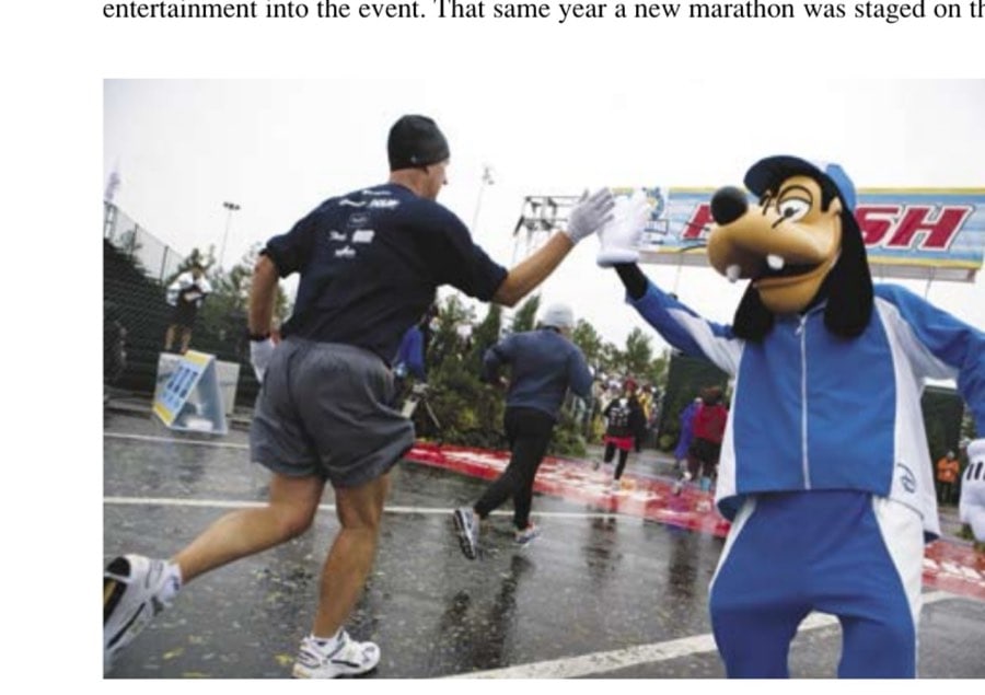 The Unstoppable 21St-Century Marathon Boom 16 Only at the Walt Disney World Marathon can you get a finisher's high-five like this.