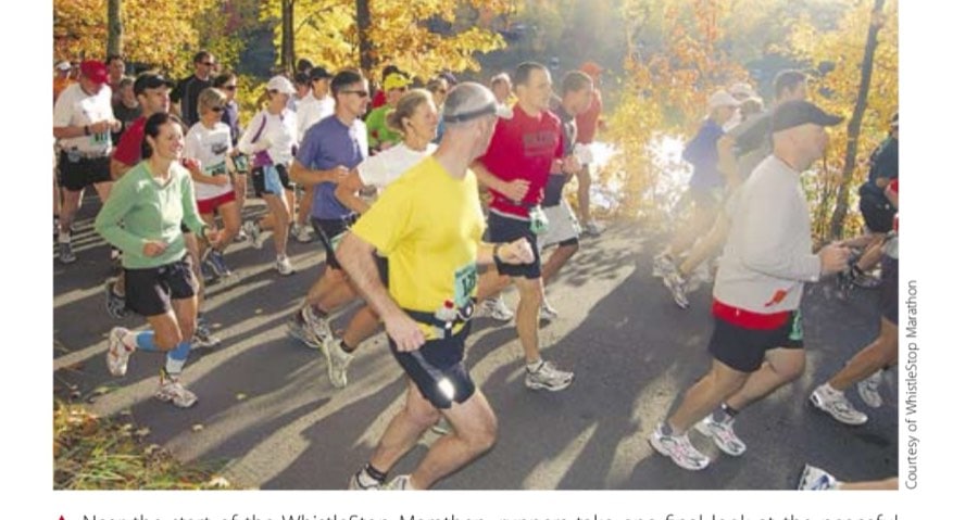Near the start of the WhistleStop Marathon, runners take one final look at the peaceful lake and the sleeping campers.