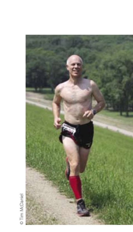 Dan Horvath runs along the top of the dam during the Another Dam 50K race in June 2011.