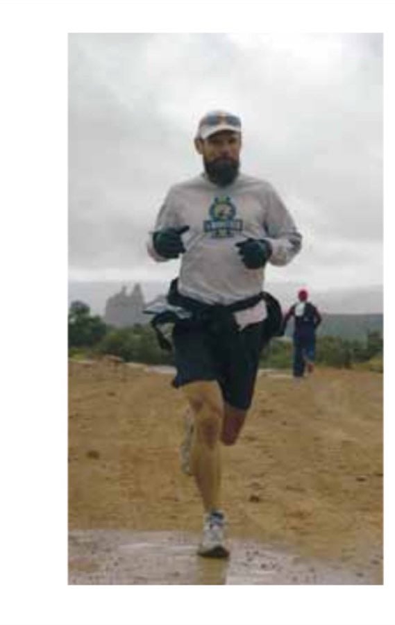 Painting On Walls 39 Bryan Goding (left), from Fort Collins, Colorado, leading the 50-mile at mile 18 of the inaugural Slickrock 50K, 50-Mile, 100-Mile, held in Moab, Utah.